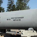 Large monel clad shell and tube heat exchanger.